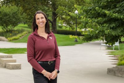 Dean of Students Meaghan Davidson stands outside.
