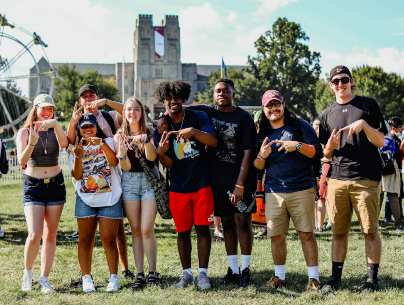 Students in a group throwing up VT hands
